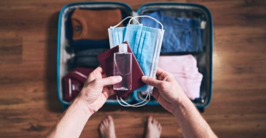 Organized suitcase with limited clothes demonstrating the viral 5-4-3-2-1 packing strategy