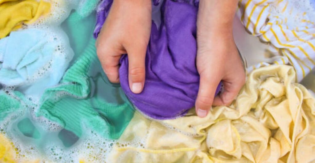 Using soap and water mixture to remove stains from fabric