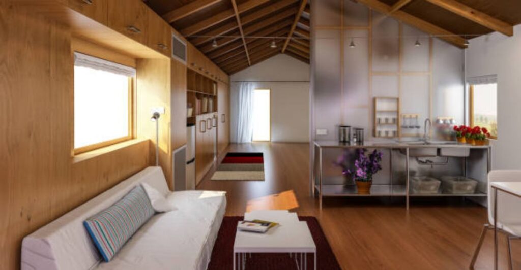Small apartment with floor-to-ceiling shelves and wall-mounted organizers for efficient storage.