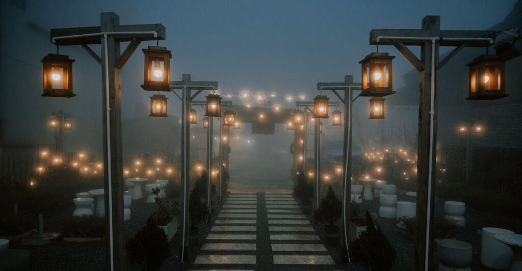 Vintage metal lanterns arranged neatly along a garden path.