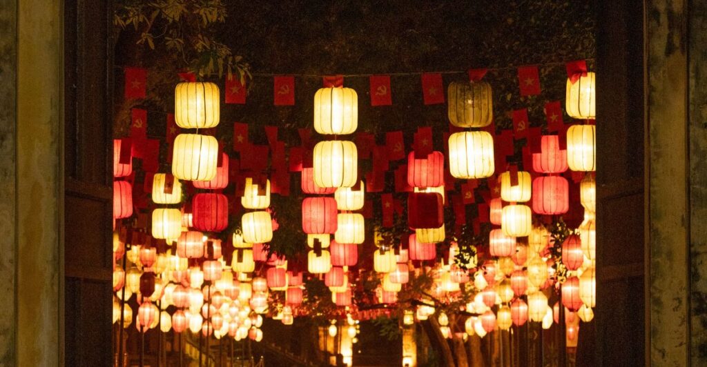 Mason jar lanterns lining a rustic garden pathway.