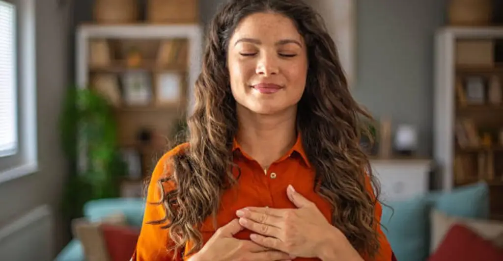 Person handing a heartfelt thank-you note to a coworker as a gesture of gratitude and respect