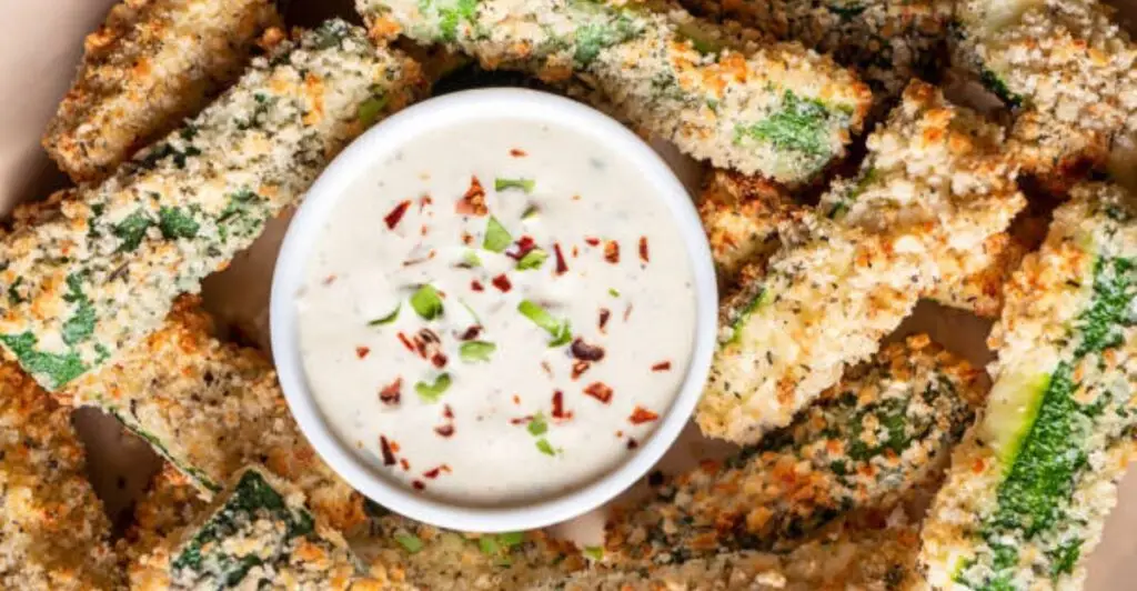Crispy Parmesan zucchini fries baked until golden brown with fresh herbs