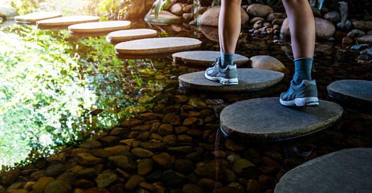 Person climbing a staircase made of broken stones, symbolizing turning setbacks into success.