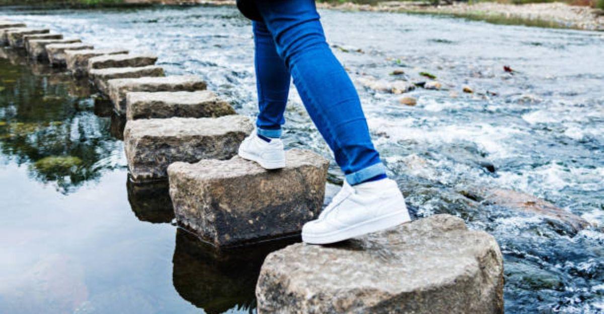 Entrepreneur overcoming obstacles on a winding path toward achievement and success.