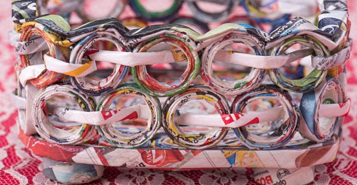 Colorful handmade storage basket woven from recycled magazine paper rolls for eco-friendly home organization.