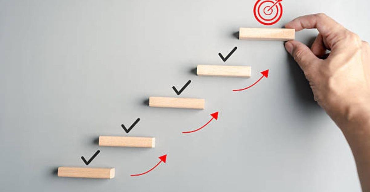 Close-up of feet taking the first step on a pathway representing progress toward aspirations.